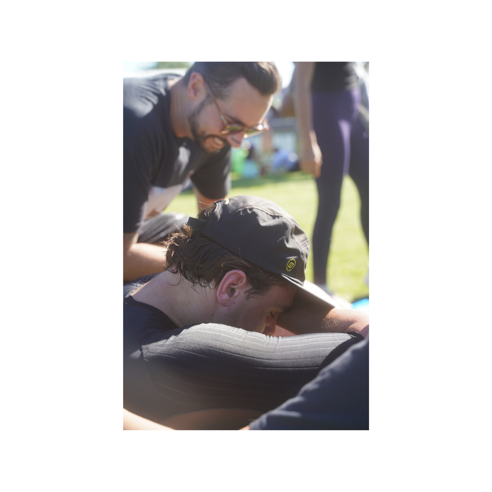Athlete receiving recovery treatment outdoors