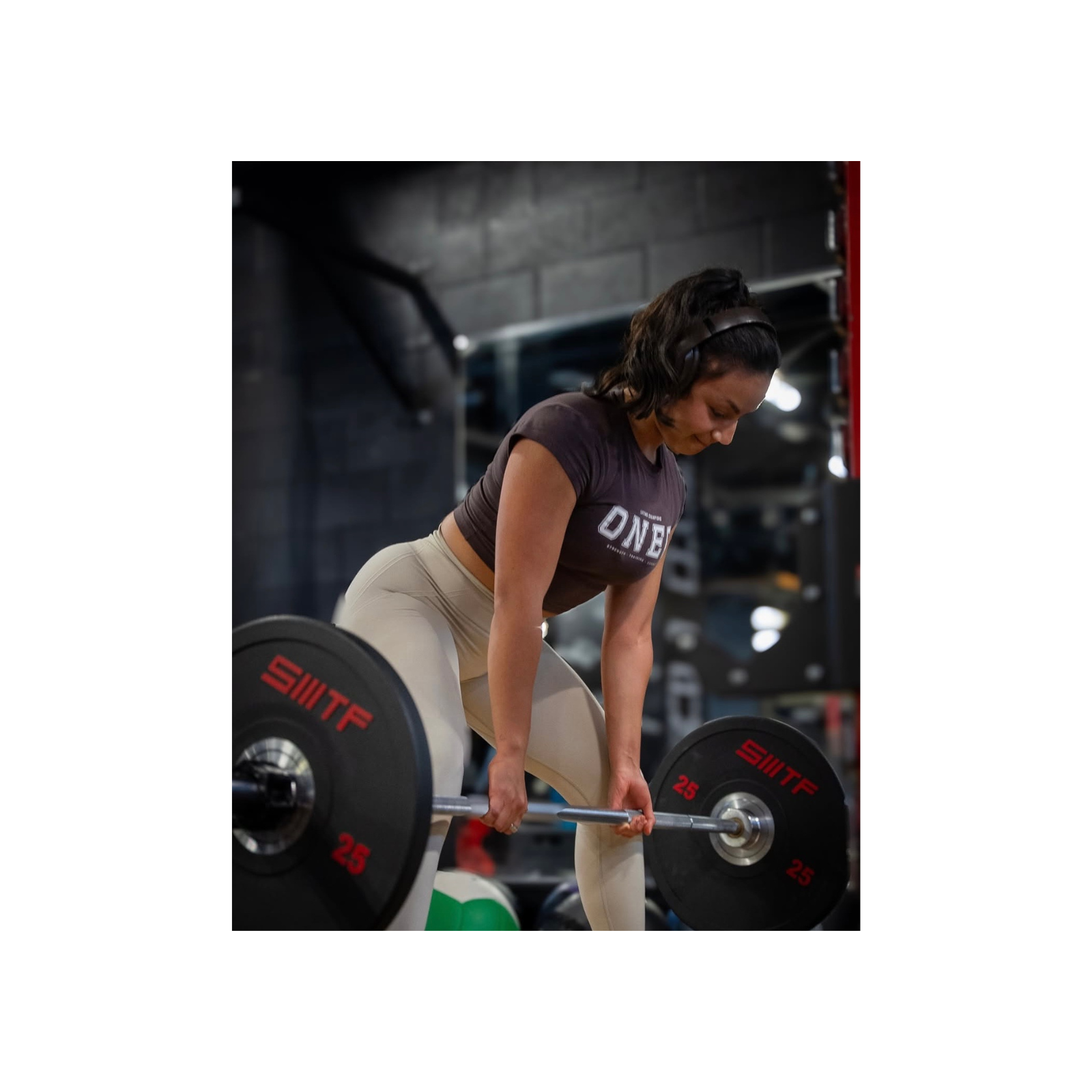 Athlete lifting a barbell in the gym